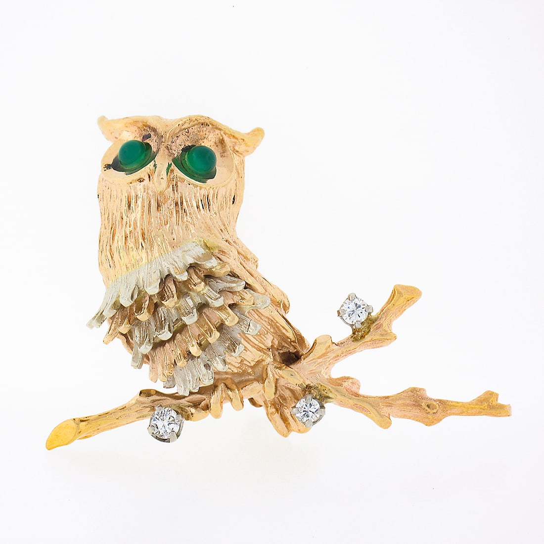 Vintage 14K Two Tone Gold Diamond Chalcedony Owl Brooch: Vintage 14K Two Tone Gold Diamond Chalcedony Owl Brooch This exquisite vintage brooch features a beautifully detailed, textured owl perched on a branch, crafted from solid 14K two-tone gold. The intri
