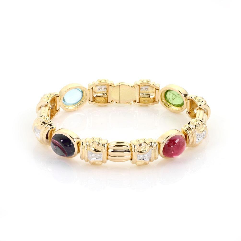 Elegant 14k Two Tone Gold Diamond Tourmaline Link Bracelet: Elegant 14k Two Tone Gold Diamond Tourmaline Link Bracelet This exquisite bracelet features a stunning combination of 14k yellow and white gold, elegantly designed with four oval frames. Each frame is