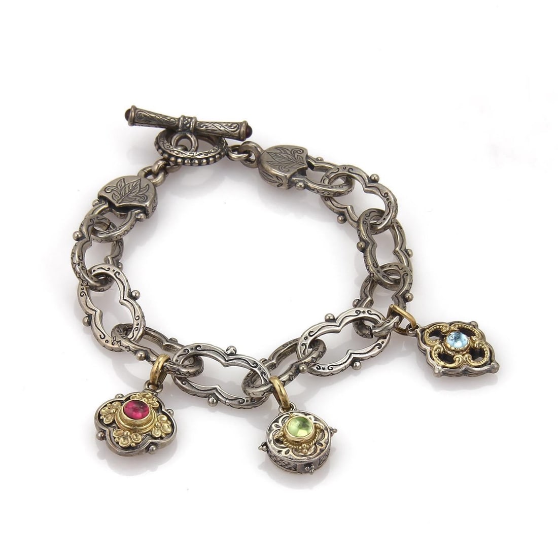 Konstantino Sterling Silver Bracelet with 18k Gold Floral Tourmaline Charms: Konstantino Sterling Silver Bracelet with 18k Gold Floral Tourmaline Charms This pre-owned bracelet is crafted from sterling silver with 18k yellow gold and features fancy engraved long chain links, t