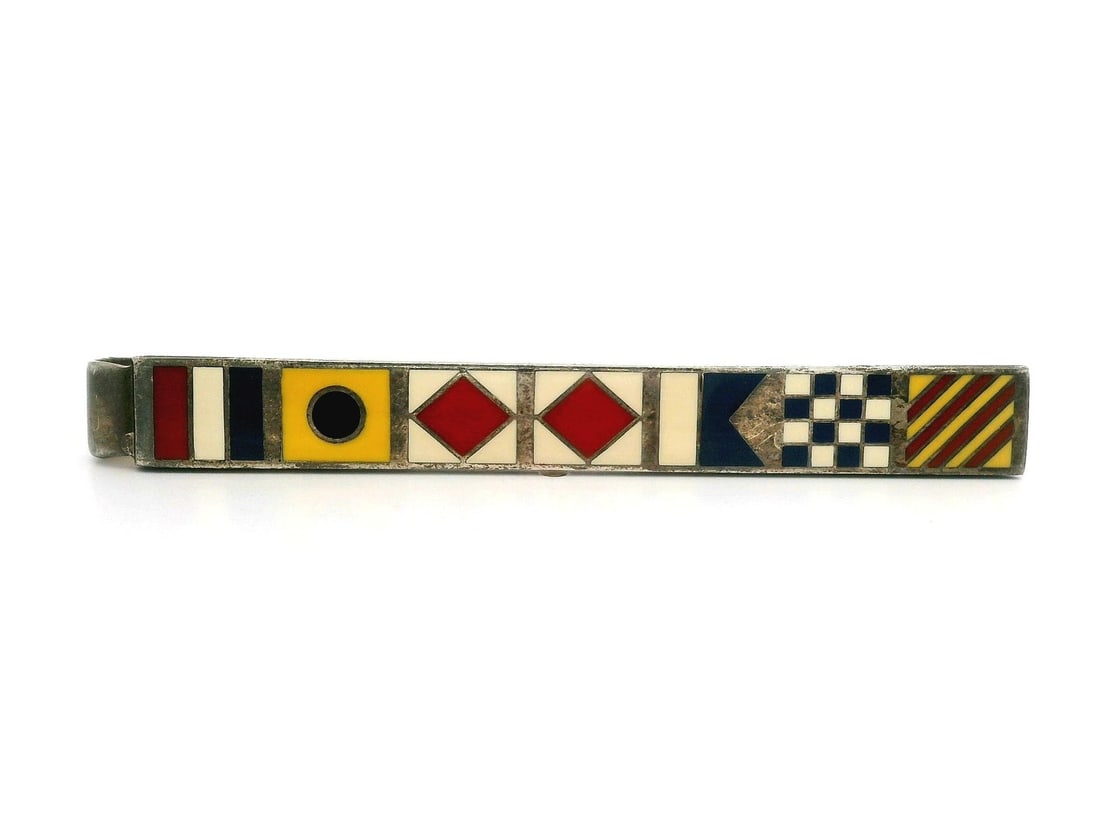 Tiffany & Co. Sterling Silver Enamel Nautical Flags Tie Bar: Tiffany & Co. Sterling Silver Enamel Nautical Flags Tie Bar This exquisite tie bar from Tiffany & Co. showcases a unique nautical flags design crafted in solid sterling silver. The piece features vibr