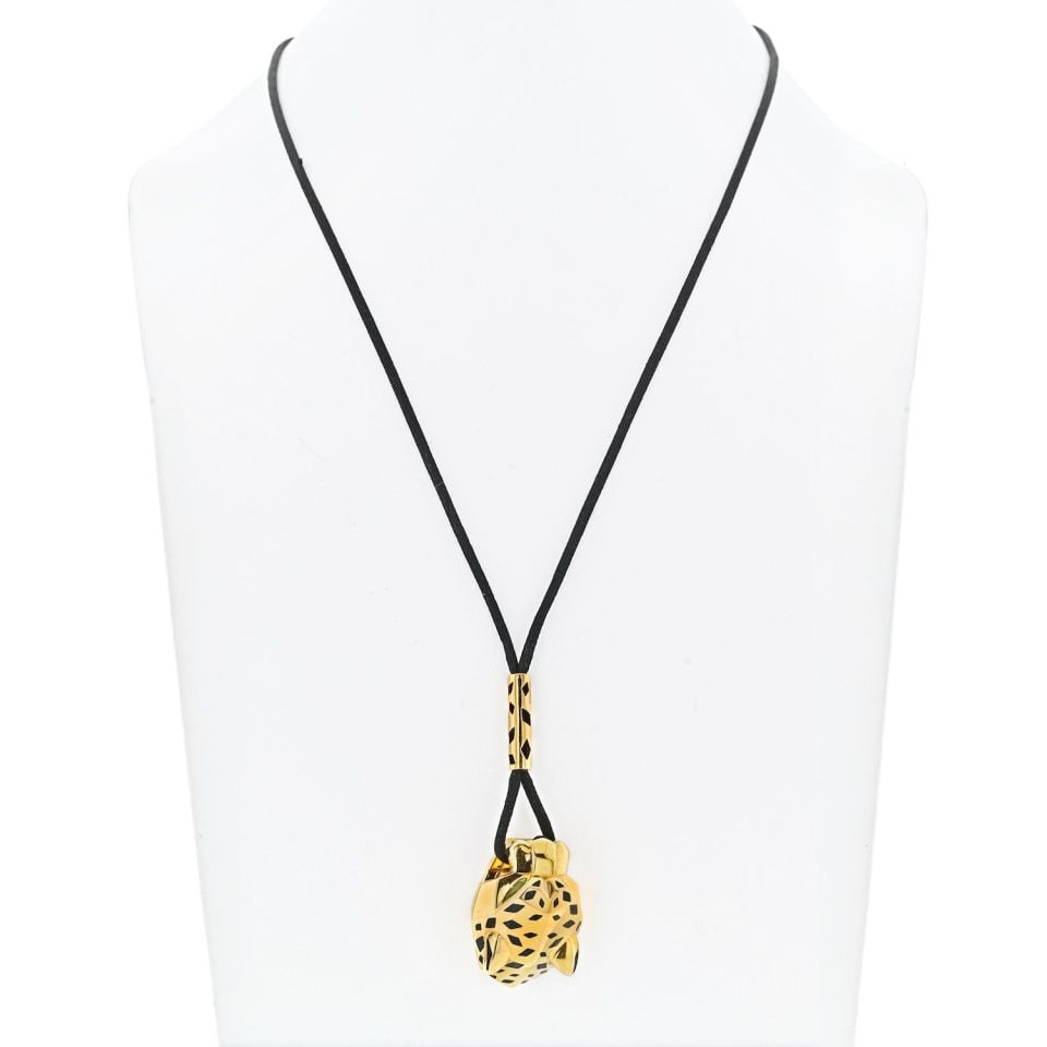 Cartier 18K Yellow Gold Panthere Lariat Necklace with Silk Cord: Cartier 18K Yellow Gold Panthere Lariat Necklace with Silk Cord The 18K Yellow Gold Panthere de Cartier lariat necklace is a striking piece that exemplifies the elegance and timeless beauty associated