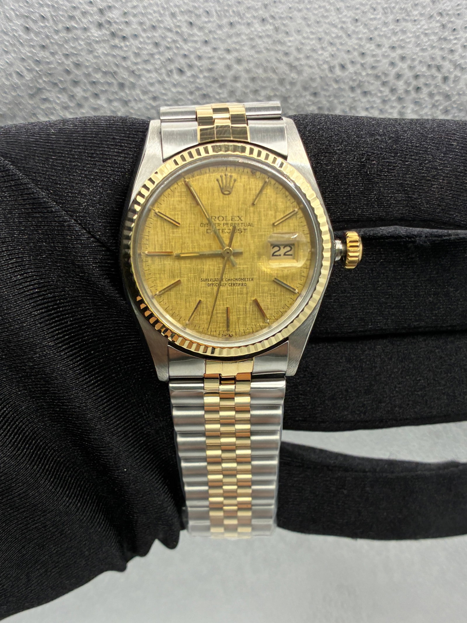 Rolex Datejust 16013 Champagne Linen Dial Aftermarket Jubilee Bracelet: Rolex Datejust 16013 Champagne Linen Dial Aftermarket Jubilee Bracelet This Rolex Datejust features a champagne linen stick dial, fluted bezel, and is paired with an aftermarket Jubilee bracelet. The 