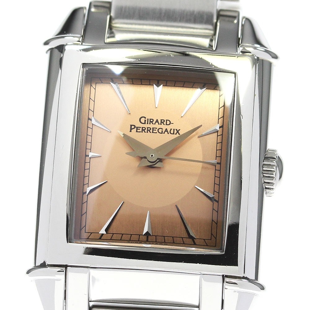 Girard Perregaux Vintage Ladies Stainless Steel Manual Winding Watch: Girard Perregaux Vintage Ladies Stainless Steel Manual Winding Watch This Girard Perregaux 25900.1.11.911 women's wristwatch features a stainless steel case and bracelet with an orange dial. The watch