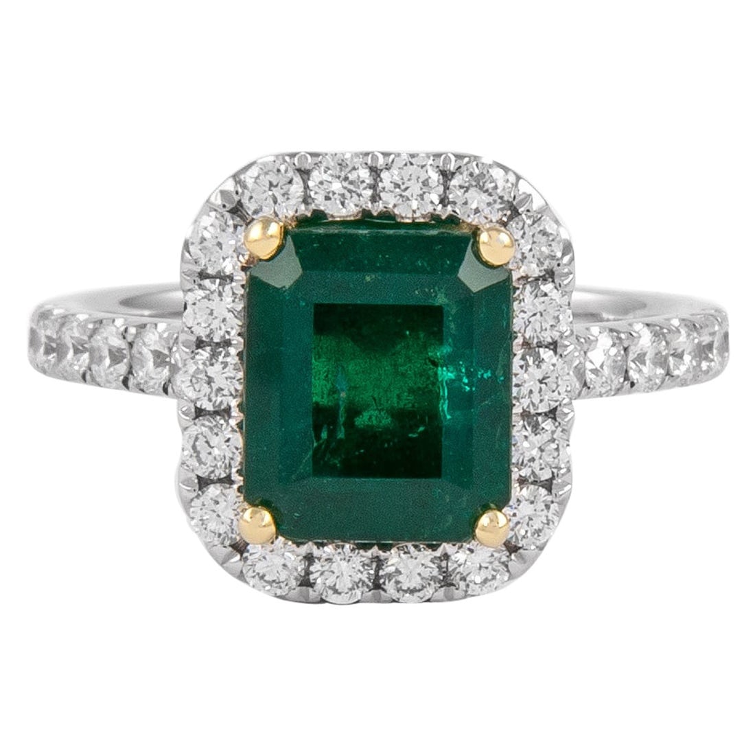 GIA 3.23ct Emerald Diamond Halo Ring 18k Gold: GIA 3.23ct Emerald Diamond Halo Ring 18k Gold This stunning GIA certified ring features a captivating 3.23 carat total gemstone weight, showcasing a 2.51 carat emerald cut emerald that is complemented