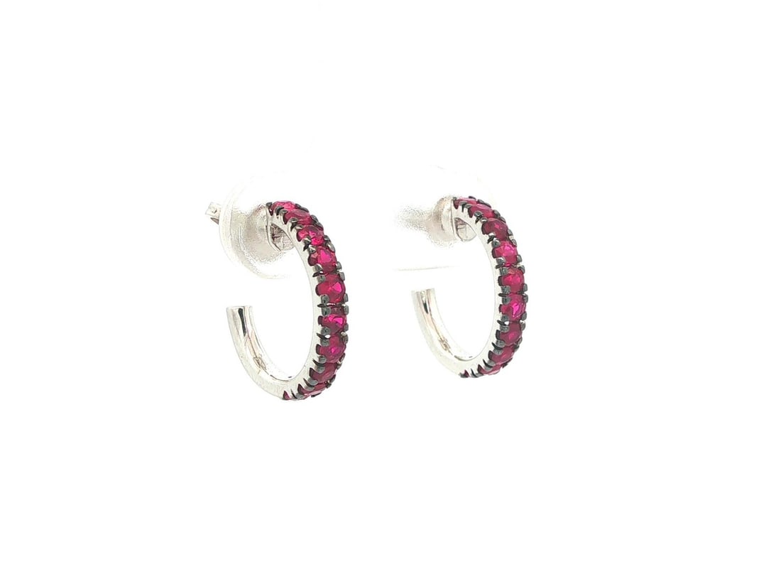 18k White Gold Ruby Huggie Hoop Earrings with 0.90ctw Natural Red Stones: 18k White Gold Ruby Huggie Hoop Earrings with 0.90ctw Natural Red Stones These un-used huggie cuff hoop earrings feature vivid, rich red natural rubies with a combined carat weight of approximately 0.