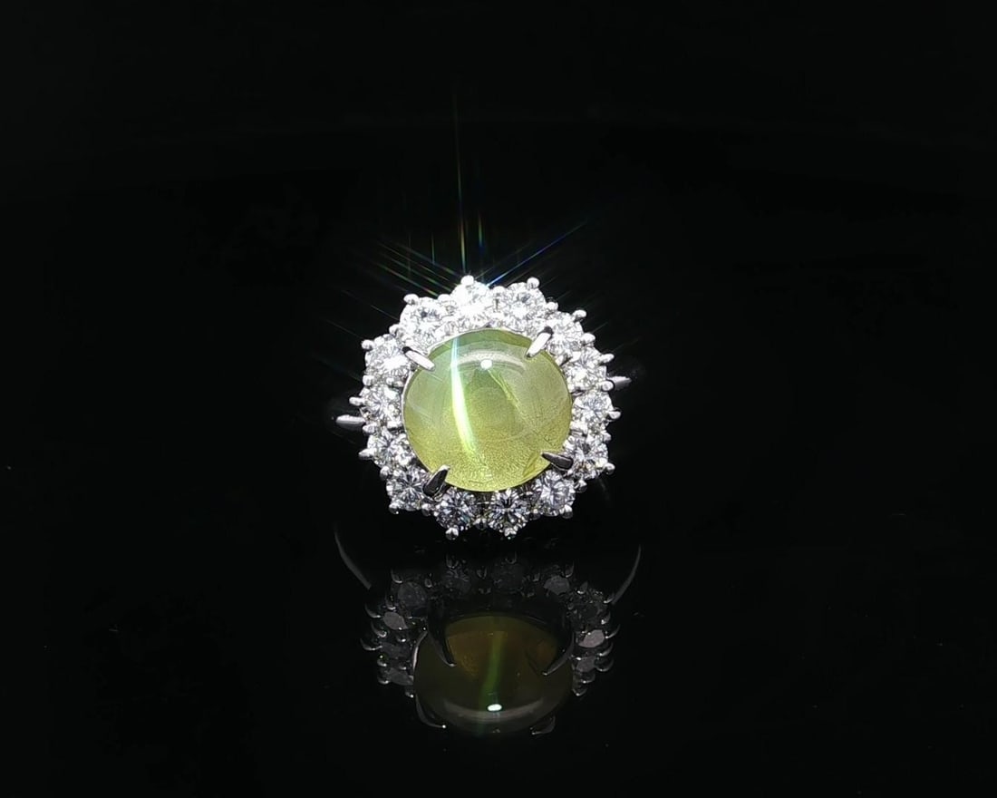 Platinum Cat's Eye Diamond Halo Cocktail Ring Size 5.5: Platinum Cat's Eye Diamond Halo Cocktail Ring Size 5.5 This platinum cocktail ring features a stunning 4.63 carat natural yellow cat's eye gemstone in a round cabochon cut, prong set at the center. Su