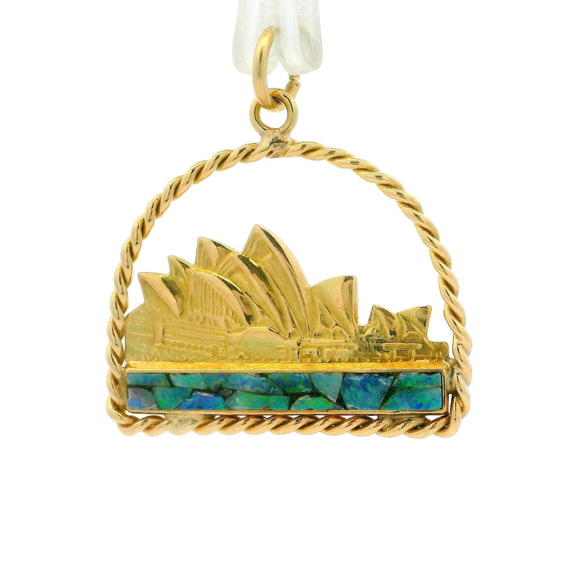 14k Yellow Gold Sydney Opera House Opal Pendant Collectible: 14k Yellow Gold Sydney Opera House Opal Pendant Collectible This stunning collectible pendant features a detailed depiction of the Sydney Opera House, crafted from solid 14k yellow gold. The pendant s