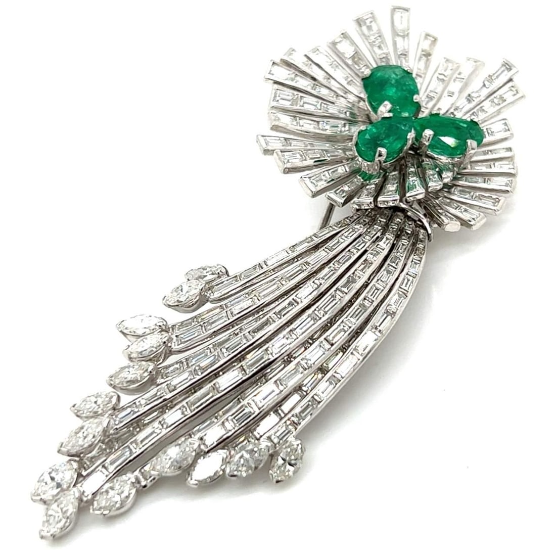 Art Deco Platinum Brooch with 3 Emeralds and 213 Diamonds: Art Deco Platinum Brooch with 3 Emeralds and 213 Diamonds This exquisite Art Deco brooch is crafted in platinum and features a stunning combination of emeralds and diamonds. The piece weighs 37.8 gram