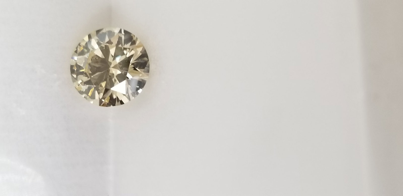 Loose Diamond - ROUND 3.37ct Faint Yellow VS2: Loose Diamond - ROUND 3.37ct Faint Yellow VS2 Source: Natural Shape: ROUND Carats: 3.37 Color: Faint Yellow Certification: GIA The Diamond Depot Guarantee: All items in this auction are guaranteed to 