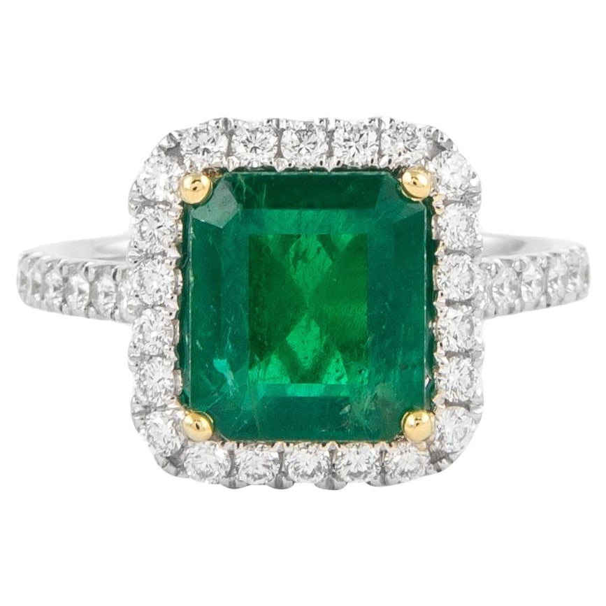 GIA 3.10ct Emerald Diamond Halo Ring 18k Gold: GIA 3.10ct Emerald Diamond Halo Ring 18k Gold This exquisite GIA certified emerald and diamond halo ring features a stunning 3.10 carats total gemstone weight. The centerpiece is a 2.53 carat emerald 