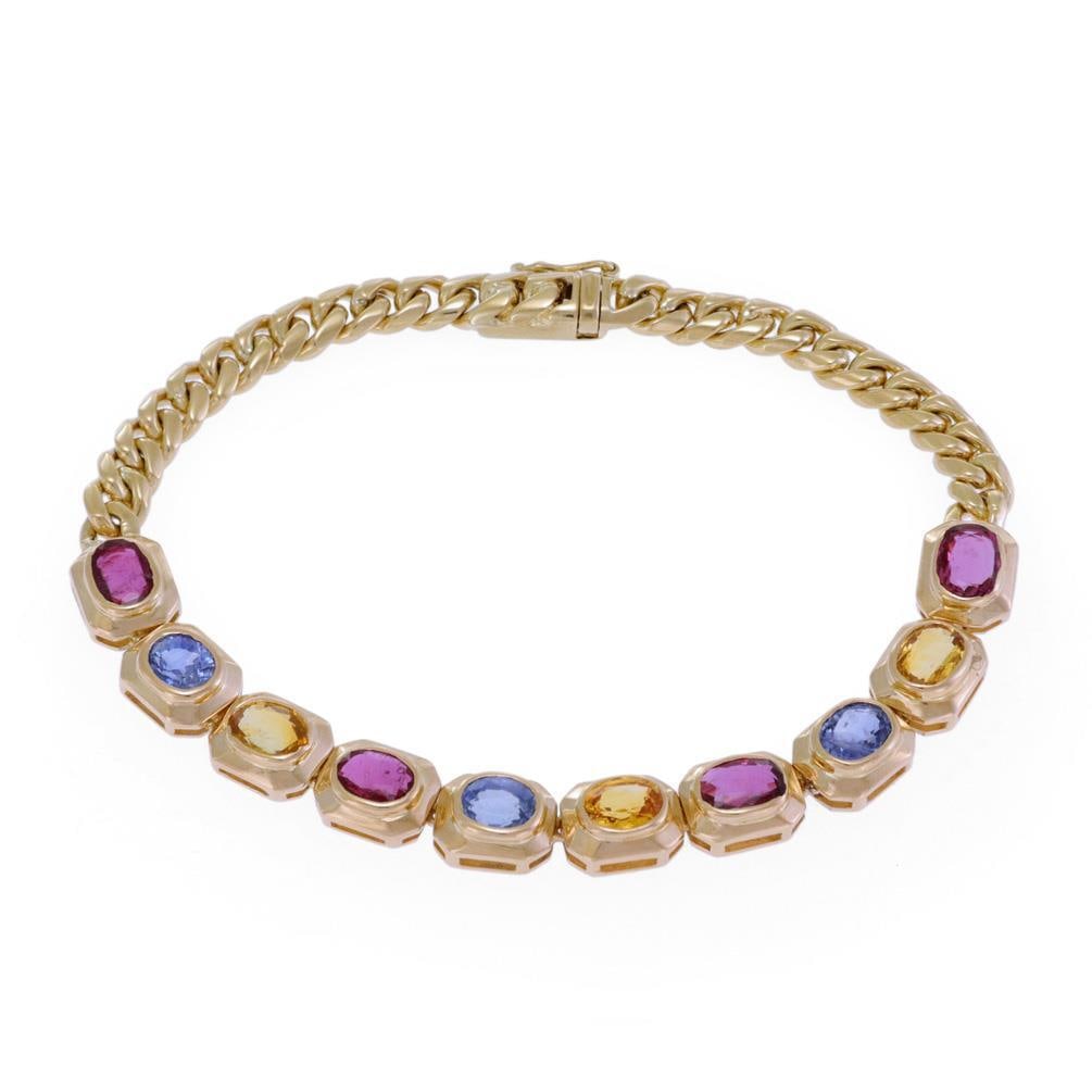 Elegant 18k Yellow Gold Multicolor Sapphire Oval Link Bracelet: Elegant 18k Yellow Gold Multicolor Sapphire Oval Link Bracelet This stunning bracelet features an exquisite design crafted from 18k yellow gold. It showcases 10 oval link frames, each adorned with bez