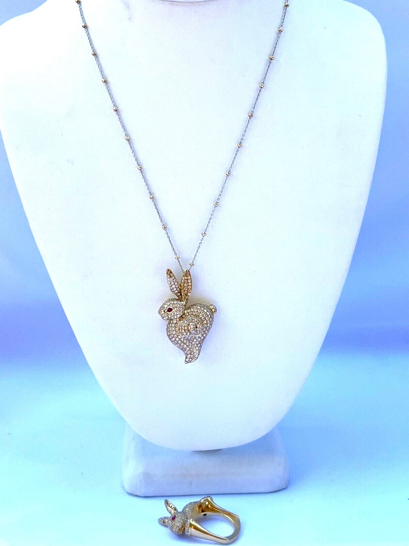 Stunning 18K Yellow Gold Rabbit Ring Size 7 & 14K Necklace Set with Diamonds: Stunning 18K Yellow Gold Rabbit Ring Size 7 & 14K Necklace Set with Diamonds Discover this exquisite French jewelry set featuring an 18K yellow gold rabbit ring (size 7) and a matching necklace. The r