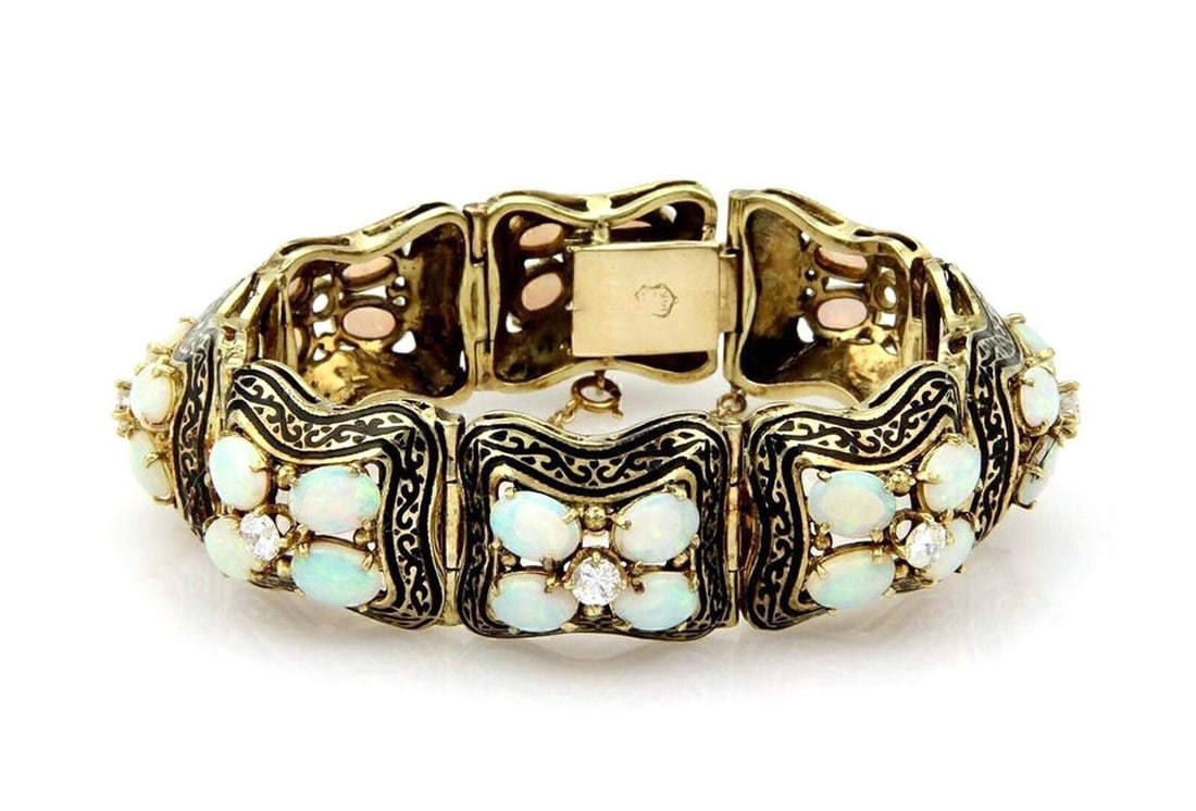 Vintage 14K Yellow Gold Opal Diamond Bracelet with Black Enamel: Vintage 14K Yellow Gold Opal Diamond Bracelet with Black Enamel This vintage estate chain bracelet is crafted in solid 14K yellow gold with black enamel accents. It features oval opals and diamonds, w