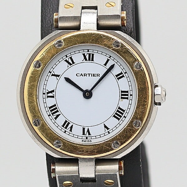 Cartier Santos Ladies Quartz Watch Yellow Gold Steel White Dial 0033110: Cartier Santos Ladies Quartz Watch Yellow Gold Steel White Dial 0033110 This is a pre-owned Cartier Santos Round Quartz ladies wristwatch, featuring a white dial with a yellow gold and stainless steel
