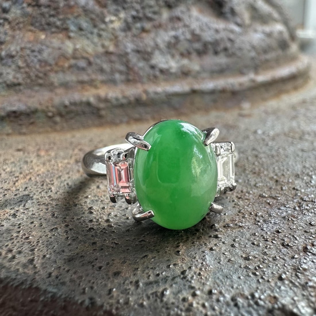 Platinum Cocktail Ring with GIA Burma A Jade and Emerald Cut Diamonds: Platinum Cocktail Ring with GIA Burma A Jade and Emerald Cut Diamonds Classic cocktail ring crafted in solid PT900 platinum, centered with a natural genuine Burma A jadeite jade in an oval double cabo