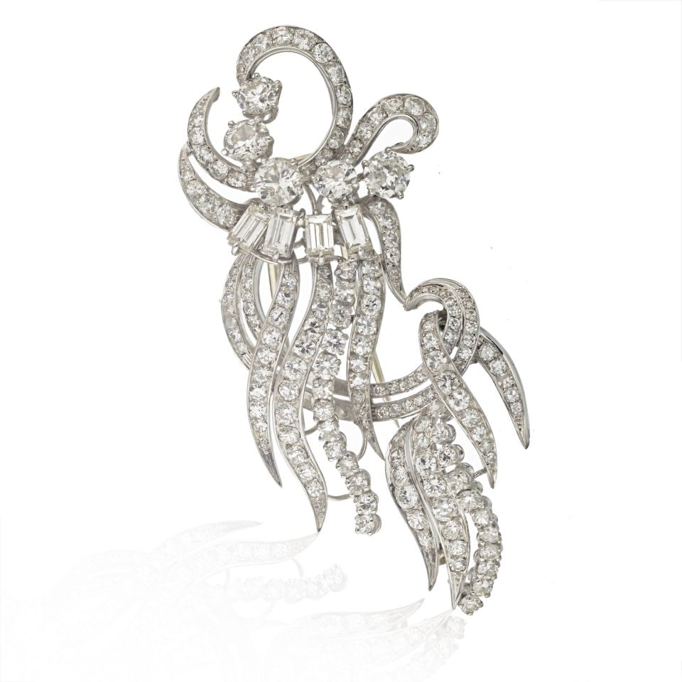 Vintage 1950's Platinum Brooch with 12 Carats Mixed-Cut Diamonds: Vintage 1950's Platinum Brooch with 12 Carats Mixed-Cut Diamonds This exquisite 1950's brooch is crafted from luxurious platinum and features a stunning array of mixed-cut diamonds, including both rou