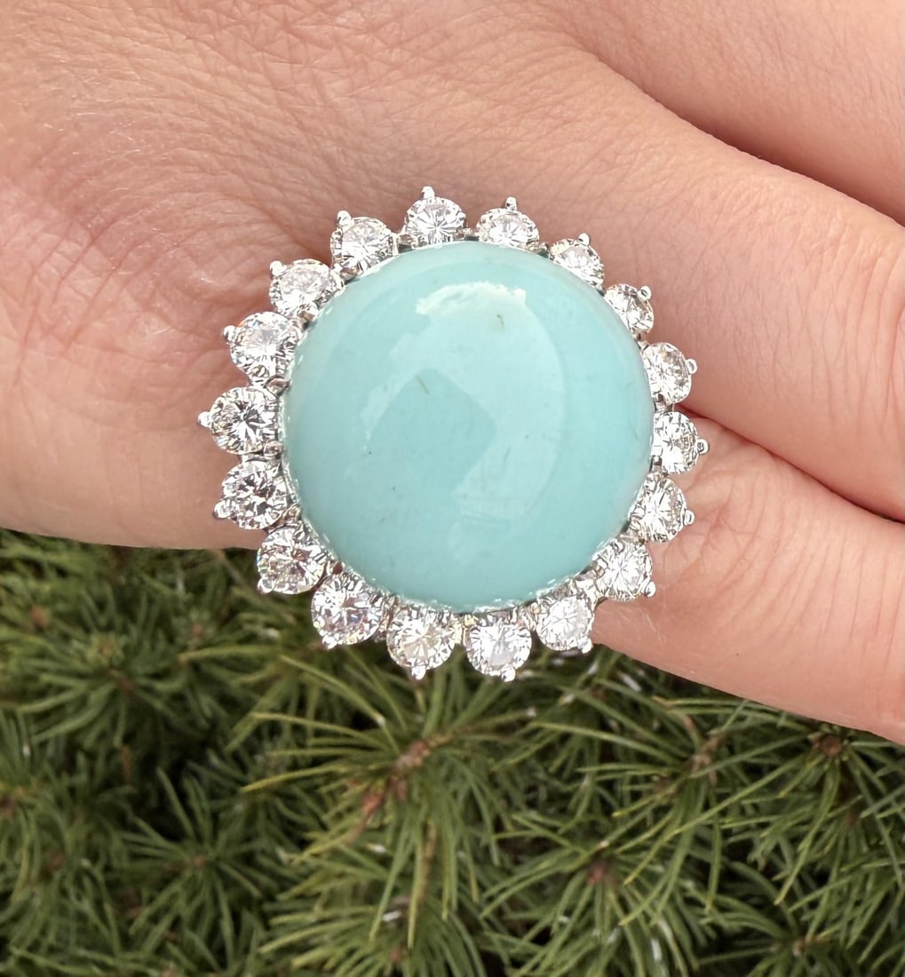 Vintage Handmade White Gold GIA 3.50ctw Turquoise Diamond Halo Ring: Vintage Handmade White Gold GIA 3.50ctw Turquoise Diamond Halo Ring This exquisite vintage handmade ring showcases a stunning large round cabochon cut natural turquoise at its center, measuring 20.06-