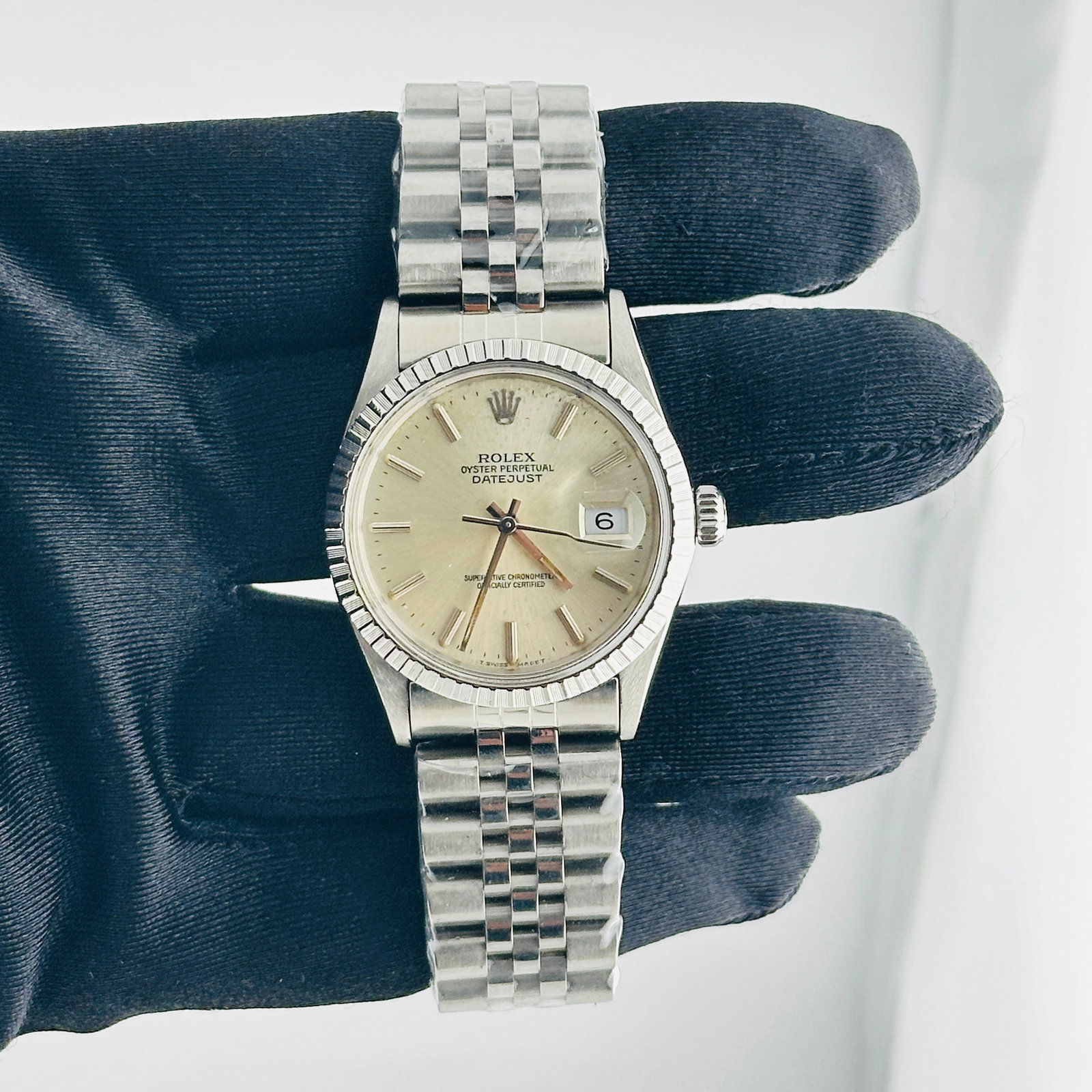 Rolex Datejust 16030 Silver Stick Dial Aftermarket Jubilee Bracelet: Rolex Datejust 16030 Silver Stick Dial Aftermarket Jubilee Bracelet This Rolex Datejust features a silver stick dial with visible spots, complemented by an aftermarket Jubilee bracelet. The watch has 
