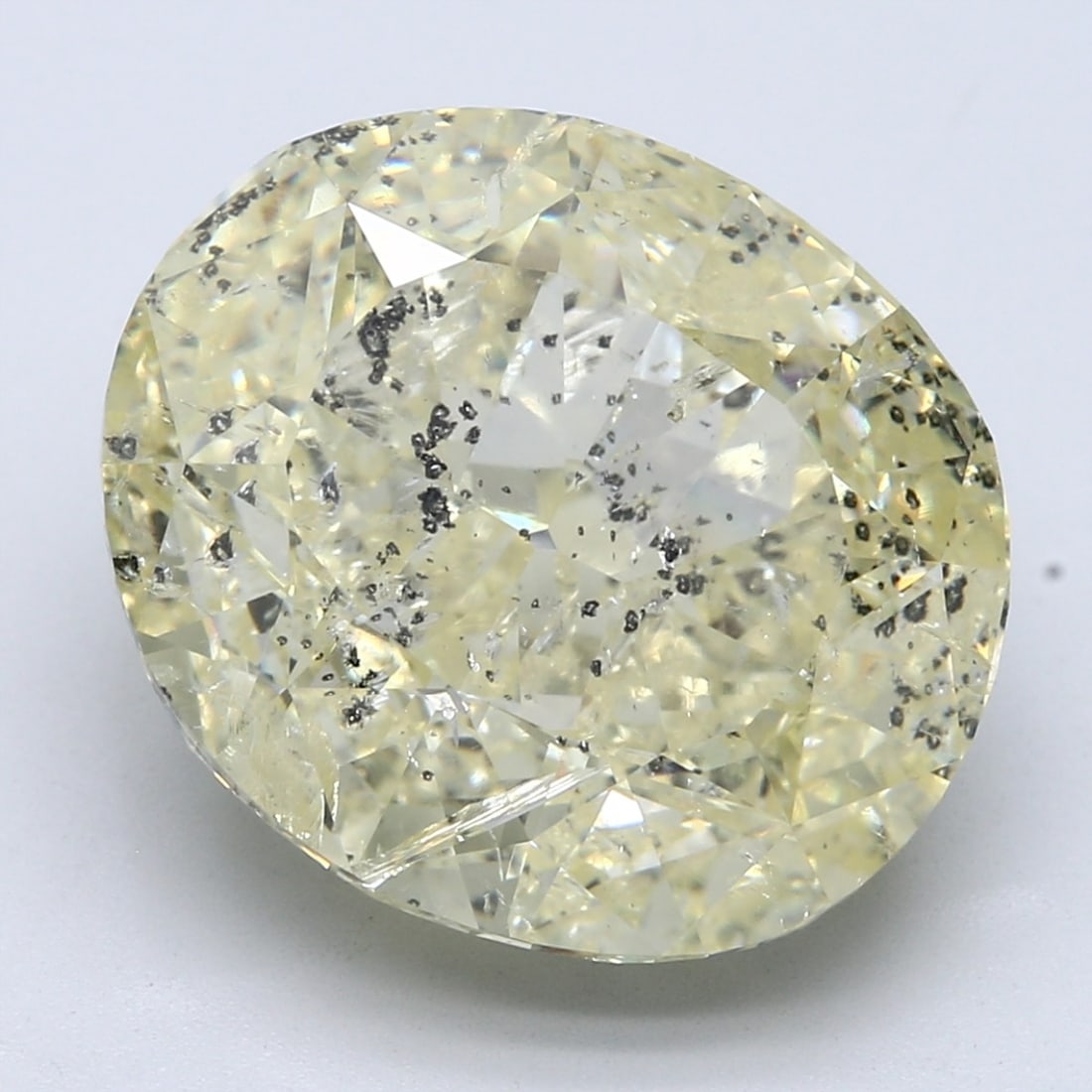 Loose Diamond - OVAL 20.0ct Fancy Light Yellow I1: Loose Diamond - OVAL 20.0ct Fancy Light Yellow I1 Source: Natural Shape: OVAL Carats: 20.0 Color: Fancy Light Yellow Certification: NONE The Diamond Depot Guarantee: All items in this auction are guar