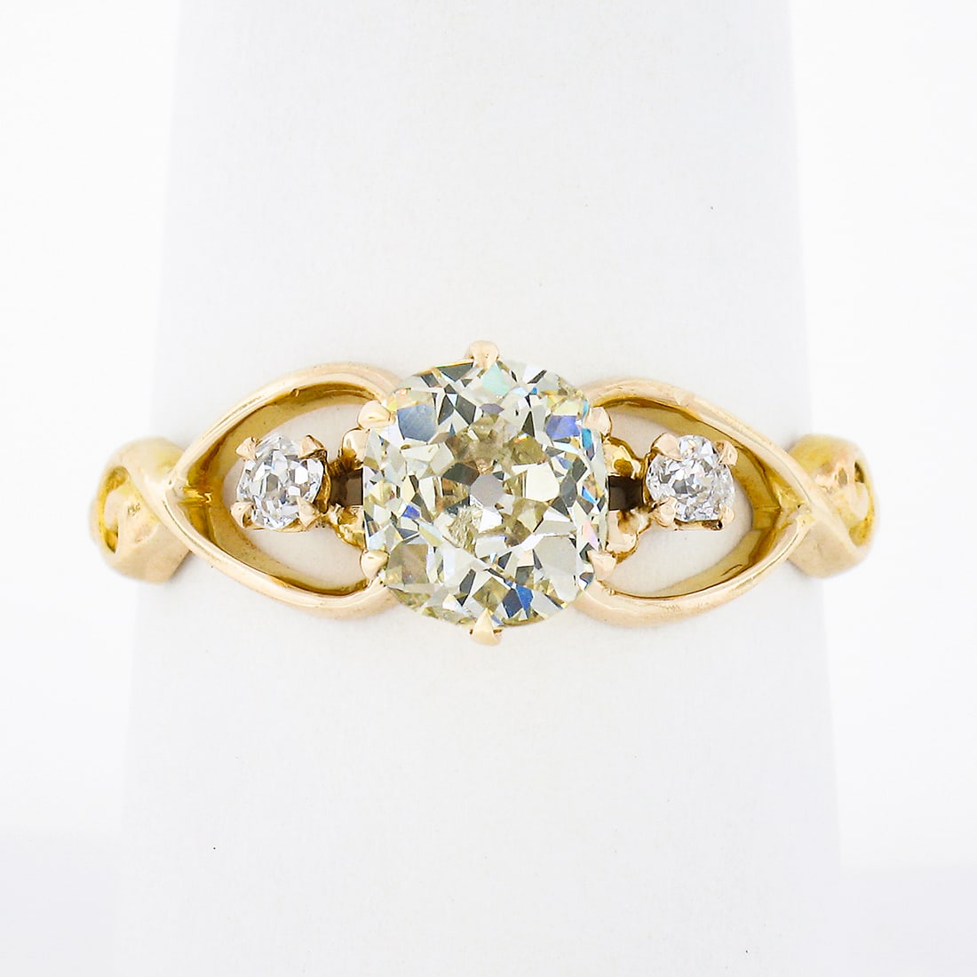 Antique Victorian 10k Gold 1.39ctw Diamond Three-Stone Engagement Ring: Antique Victorian 10k Gold 1.39ctw Diamond Three-Stone Engagement Ring This exquisite antique engagement ring showcases a stunning Victorian design crafted from solid 10k rosy yellow gold. The ring fe