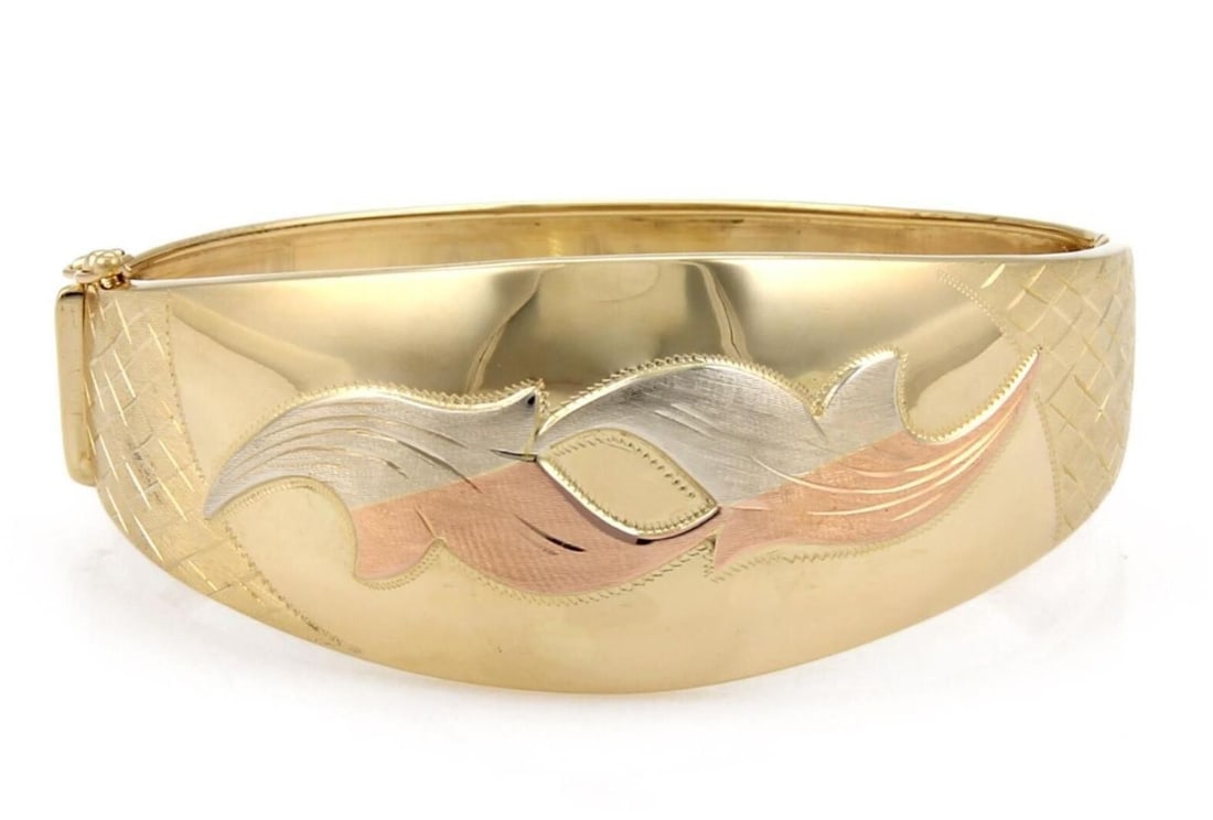 Vintage 18k Tri Color Gold Floral Dome Bangle Bracelet: Vintage 18k Tri Color Gold Floral Dome Bangle Bracelet A vintage pre-owned wide dome floral bangle bracelet crafted in 18k tri-color gold. The bracelet features a bold domed silhouette with an intrica