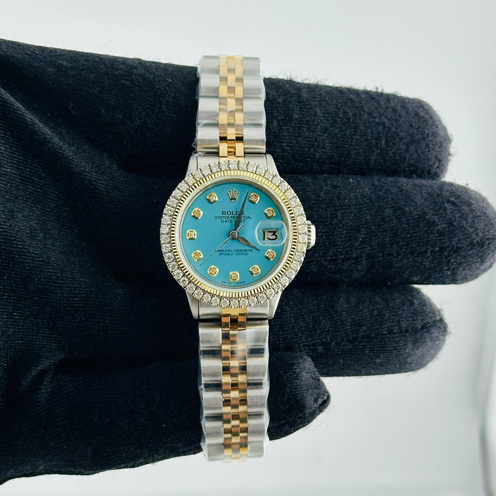 Ladies Rolex Datejust Tiffany Dial Yellow Diamond Markers Aftermarket Jubilee Bracelet 6516: Ladies Rolex Datejust Tiffany Dial Yellow Diamond Markers Aftermarket Jubilee Bracelet 6516 This ladies' watch features an aftermarket Tiffany-style dial with yellow diamond markers, set within a pron