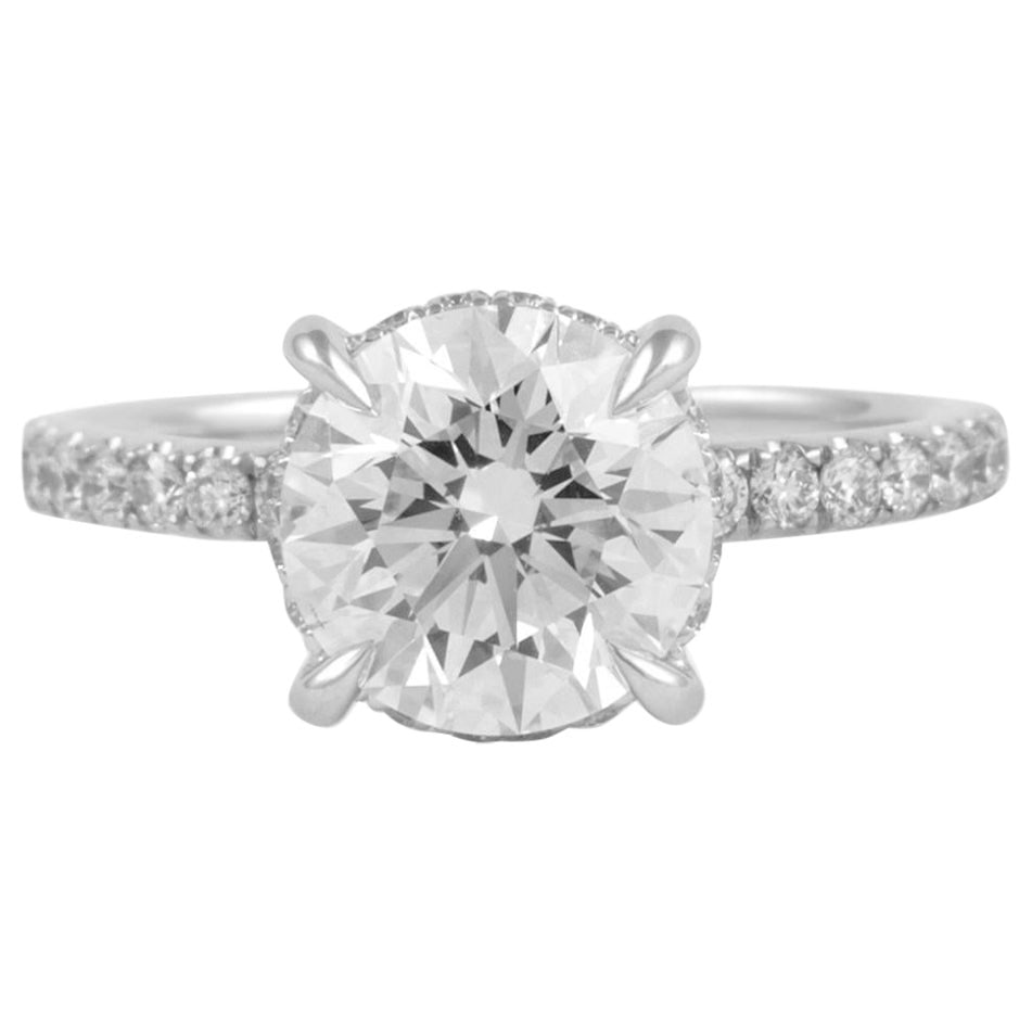 2.03ct GIA Round Diamond Ring 18k White Gold: 2.03ct GIA Round Diamond Ring 18k White Gold This exquisite GIA-certified diamond ring features a stunning 2.03 carat round brilliant diamond, graded F for color and VVS2 for clarity. The ring is set 
