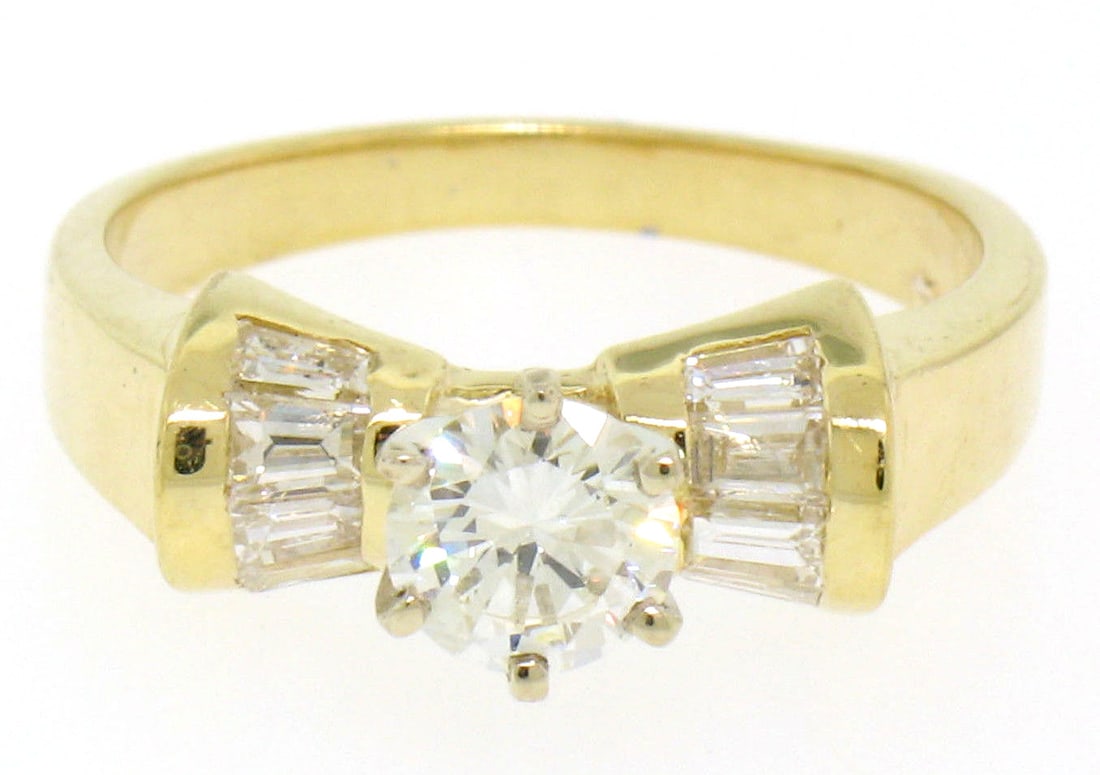 14k Yellow Gold Diamond Solitaire Ring with Baguette Accents Size 6: 14k Yellow Gold Diamond Solitaire Ring with Baguette Accents Size 6 This elegant engagement ring is crafted from solid 14k yellow gold with a solid 14k white gold head. It features a round brilliant c
