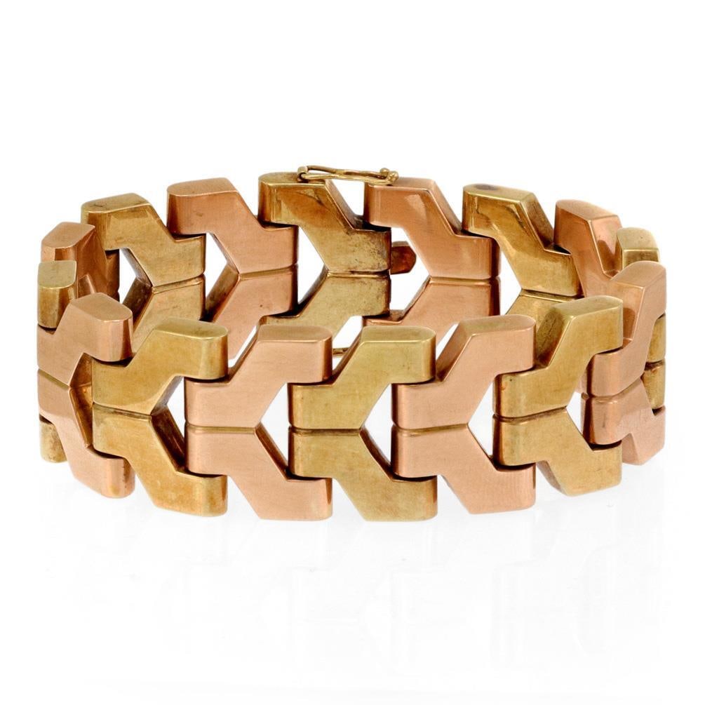 Retro 14k Yellow Rose Gold 21mm Wide Fancy Link Bracelet: Retro 14k Yellow Rose Gold 21mm Wide Fancy Link Bracelet This stunning Retro Era bracelet showcases a wide open fancy link design made from 14k yellow and rose gold. The bracelet features alternating 