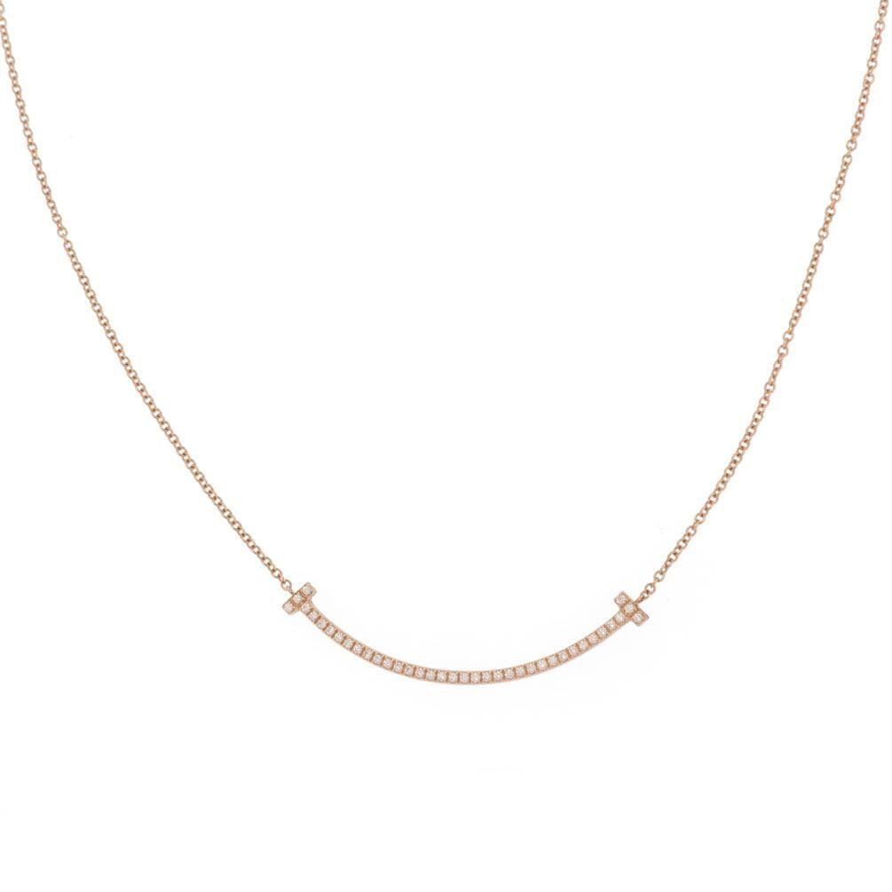 Tiffany & Co. T Smile Diamond Pendant Necklace 18k Rose Gold: Tiffany & Co. T Smile Diamond Pendant Necklace 18k Rose Gold Elevate your jewelry collection with this exquisite pendant and chain necklace from Tiffany & Co.'s T Smile Collection. Crafted from luxuri