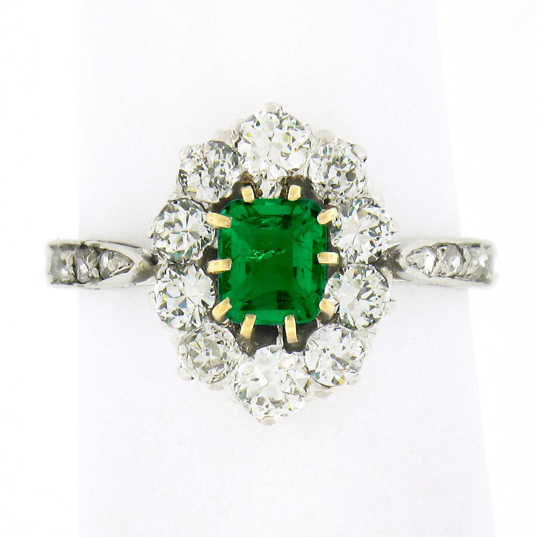 Edwardian French Platinum Emerald Halo Ring 0.66ct Diamonds Size 4.5: Edwardian French Platinum Emerald Halo Ring 0.66ct Diamonds Size 4.5 This authentic antique Edwardian era ring, crafted in France from solid .900 platinum, features a vivid green, natural emerald cut 