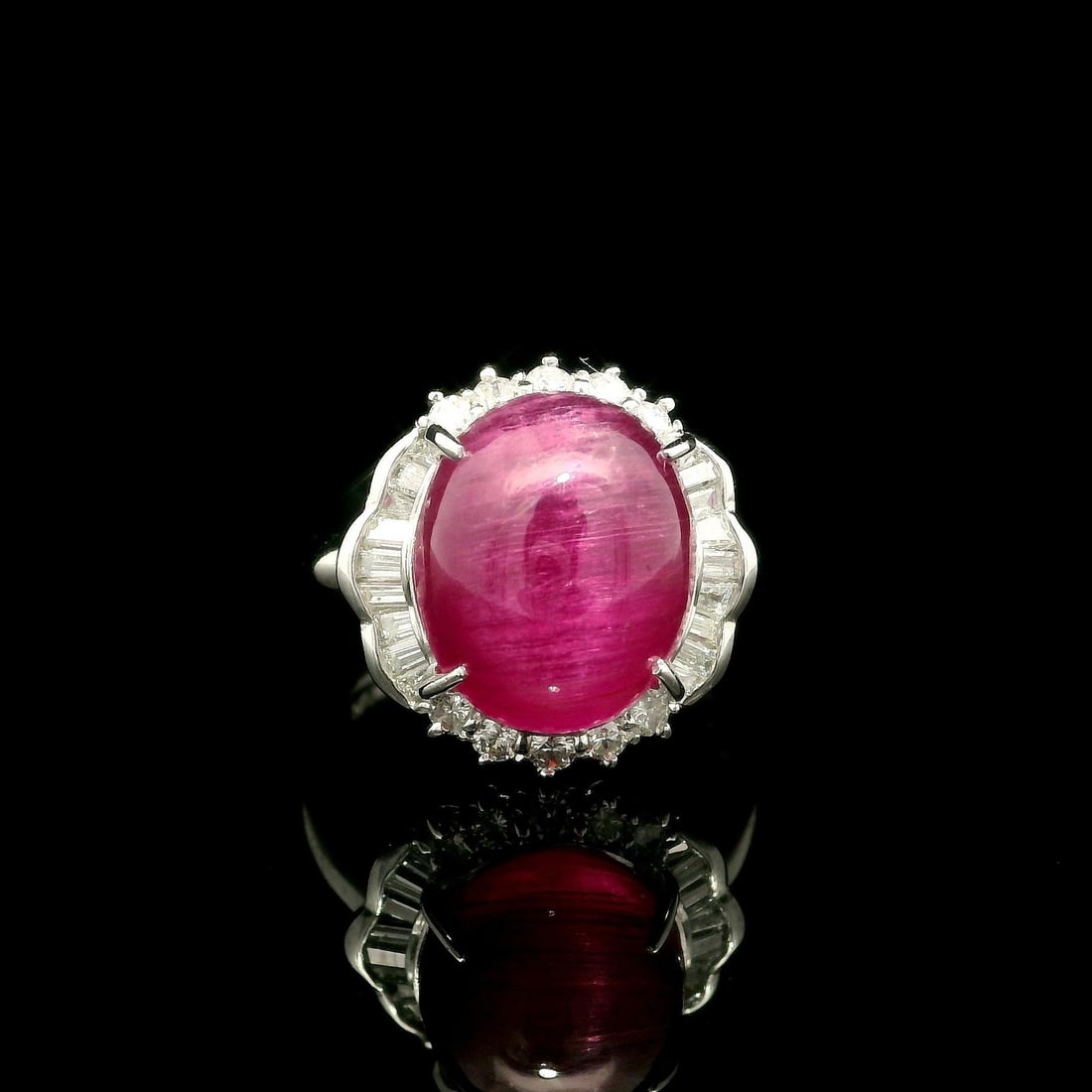 Platinum GIA Certified 7.32ct Cat's Eye Rubellite Tourmaline Ring with Diamond Halo: Platinum GIA Certified 7.32ct Cat's Eye Rubellite Tourmaline Ring with Diamond Halo This stunning cocktail ring features a natural genuine Cat's Eye Rubellite Tourmaline, showcasing an oval double cab