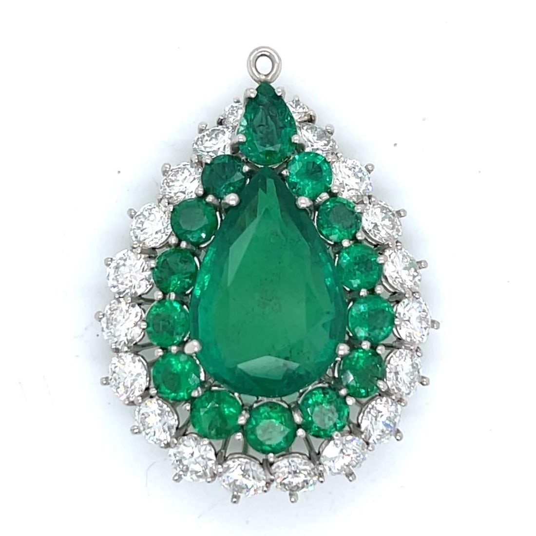 GIA Certified 9.77 Ct Emerald Diamond Pendant in Platinum: GIA Certified 9.77 Ct Emerald Diamond Pendant in Platinum This stunning pendant features a GIA Certified 9.77 Ct. emerald, elegantly set in high-quality platinum. The emerald measures 18.44 x 12.49 x 