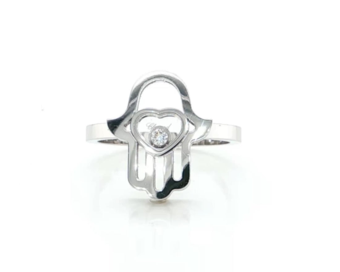 Chopard Happy Diamonds 18K White Gold Hamsa Ring Size 6.5: Chopard Happy Diamonds 18K White Gold Hamsa Ring Size 6.5 Chopard Happy Diamonds Hamsa Hand ring crafted in 18k white gold, featuring the collection's signature floating diamond beneath crystal and a 