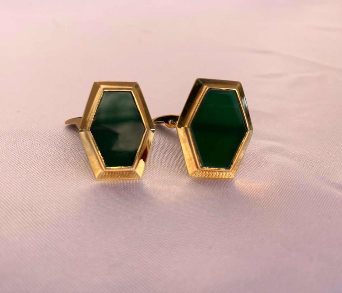 Green Carved Glass and 18K Yellow Gold French Cufflinks Pair: Green Carved Glass and 18K Yellow Gold French Cufflinks Pair This pair of French cufflinks is crafted from 18K yellow gold and features intricately carved green glass. Designed for unisex adults, the 