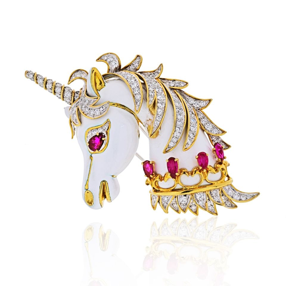 David Webb Unicorn Brooch Platinum 18K Yellow Gold Diamonds Rubies: David Webb Unicorn Brooch Platinum 18K Yellow Gold Diamonds Rubies This exquisite brooch features a stunning unicorn design, crafted from a combination of platinum and 18K yellow gold. The piece weigh