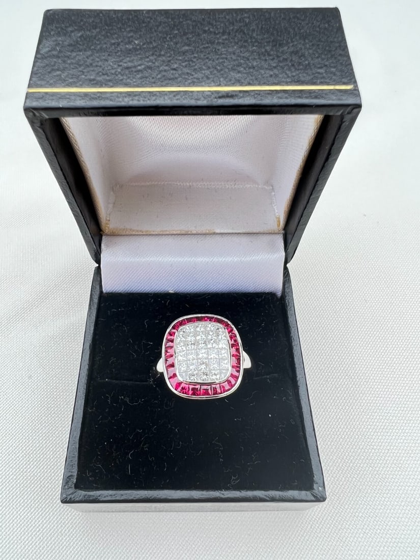 Stunning 18K White Gold Ruby Diamond Ring 6.75 ct 2.15 Ruby 1.30 Diamond: Stunning 18K White Gold Ruby Diamond Ring 6.75 ct 2.15 Ruby 1.30 Diamond This stunning 18K white gold ring showcases exquisite berme rubies and sparkling diamonds. It features a total of 1.30 ct of D 