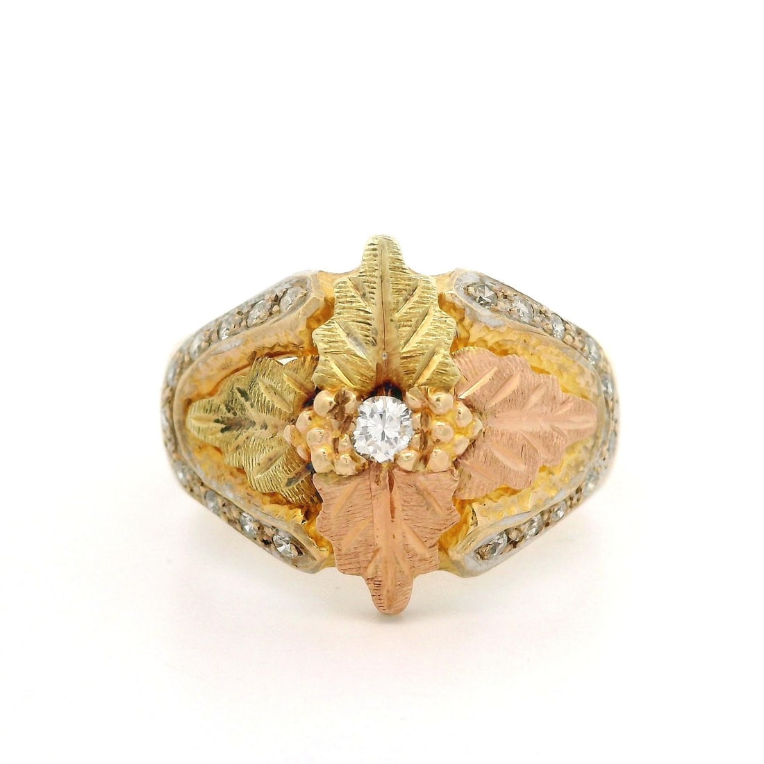 10k Tri Color Gold Diamond Leaf Band Ring 0.20ctw: 10k Tri Color Gold Diamond Leaf Band Ring 0.20ctw This stunning band ring features an exquisite combination of tri-color gold, crafted from 10k yellow, rose, and white gold. The ring showcases a textu