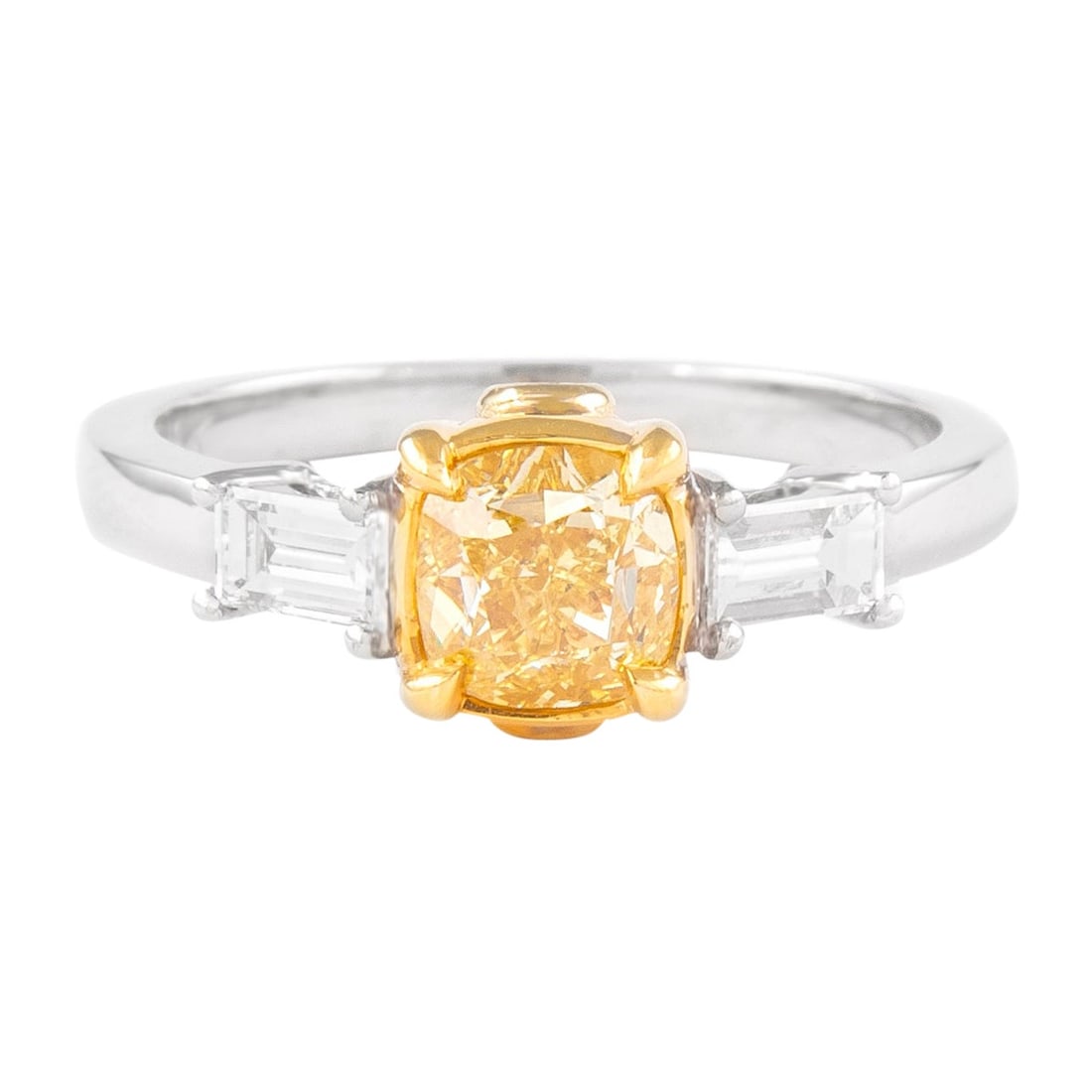 GIA 1ct Fancy Intense Yellow Diamond Three Stone Ring: GIA 1ct Fancy Intense Yellow Diamond Three Stone Ring This exquisite GIA certified three stone ring features a striking 1.00 carat Fancy Intense Yellow diamond, cut in a cushion style, boasting SI2 cl