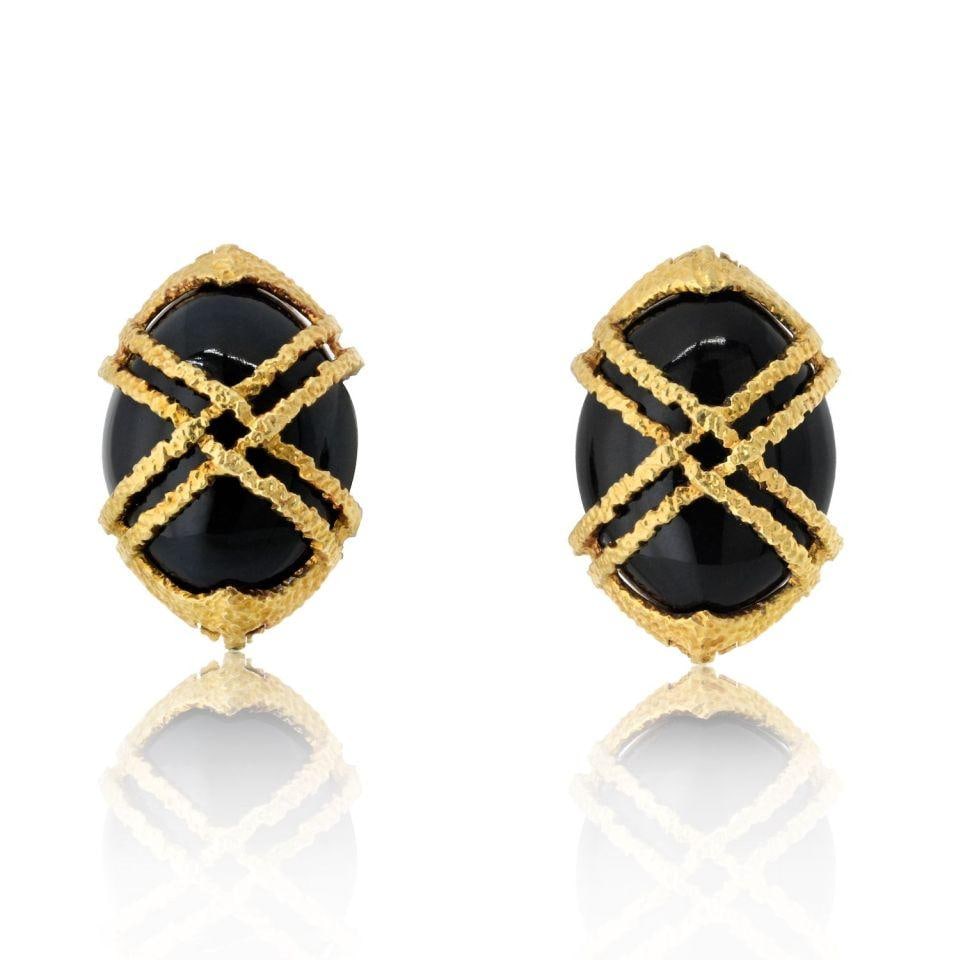 Cartier 1969 Black Jade Carved Earrings in 18K Yellow Gold: Cartier 1969 Black Jade Carved Earrings in 18K Yellow Gold These exquisite earrings from Cartier feature a stunning design crafted from 18K yellow gold and adorned with beautifully carved black jade, 