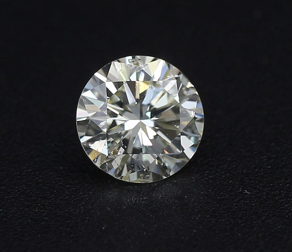 Loose Diamond - ROUND 1.04ct K SI2: Loose Diamond - ROUND 1.04ct K SI2 Source: Natural Shape: ROUND Carats: 1.04 Color: K Clarity: SI2 Certification: NONE The Diamond Depot Guarantee: All items in this auction are guaranteed to be 100% 