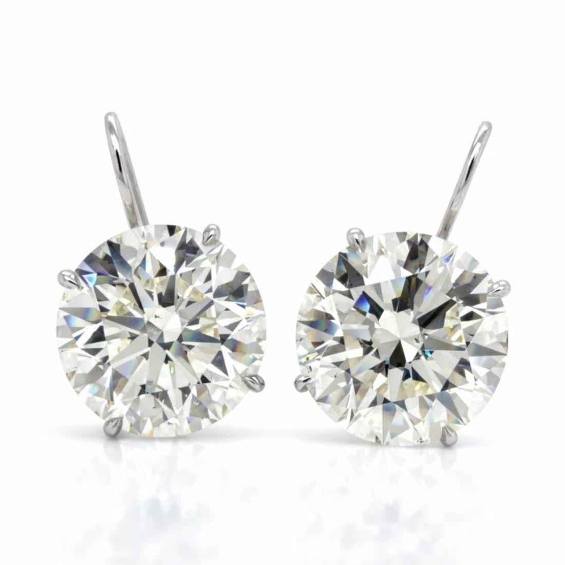 GIA Certified Diamond Earrings 20.10 Ct 18K White Gold Pair: GIA Certified Diamond Earrings 20.10 Ct 18K White Gold Pair These earrings feature two GIA certified diamonds, one weighing 10.04 carats with L color and SI1 clarity, and the other weighing 10.06 cara
