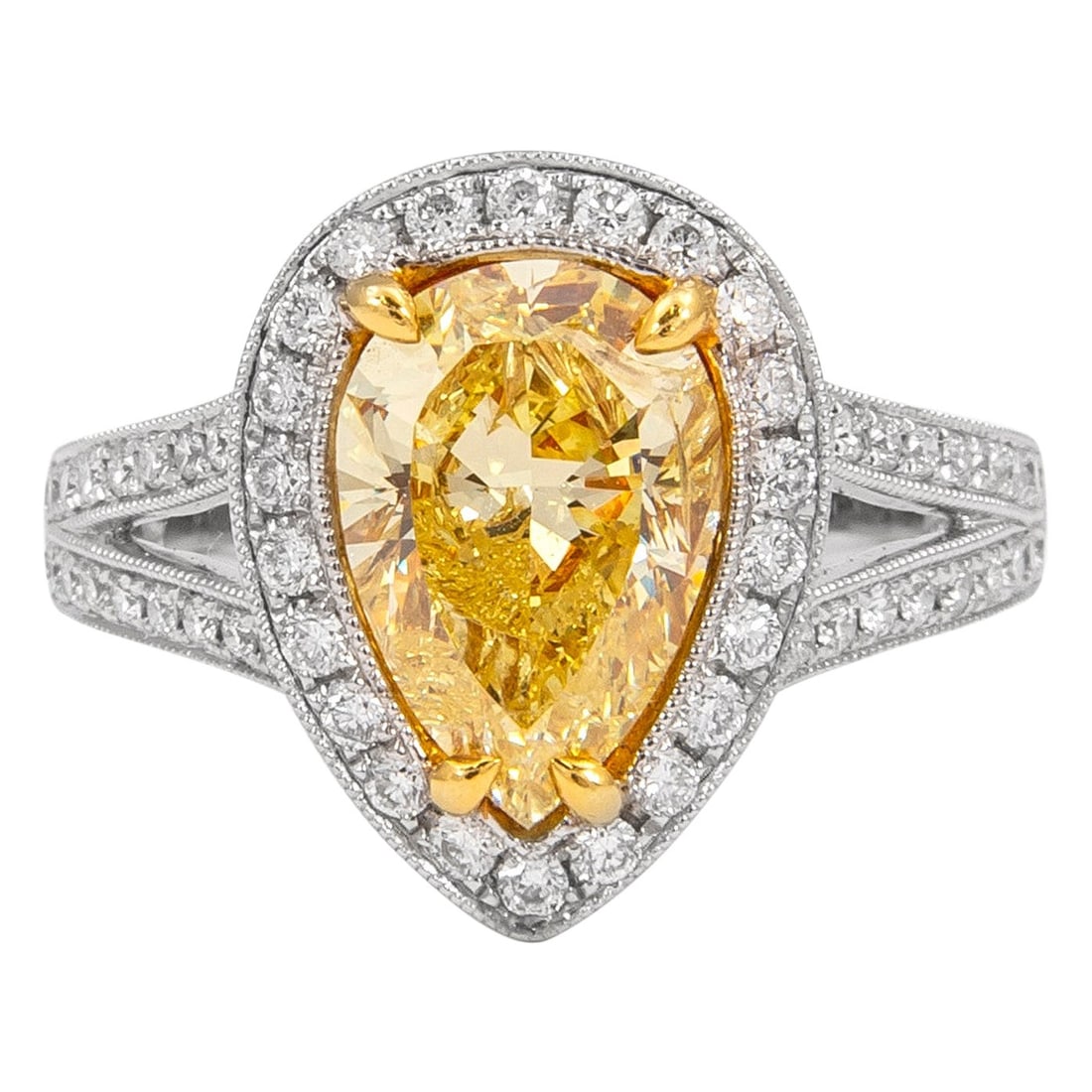 2.50ct Fancy Vivid Yellow Pear Diamond EGL Certified 18k Two Tone Halo Ring: 2.50ct Fancy Vivid Yellow Pear Diamond EGL Certified 18k Two Tone Halo Ring This contemporary ring features an EGL certified 2.50 carat Fancy Vivid Yellow pear cut diamond as its centerpiece, graded I