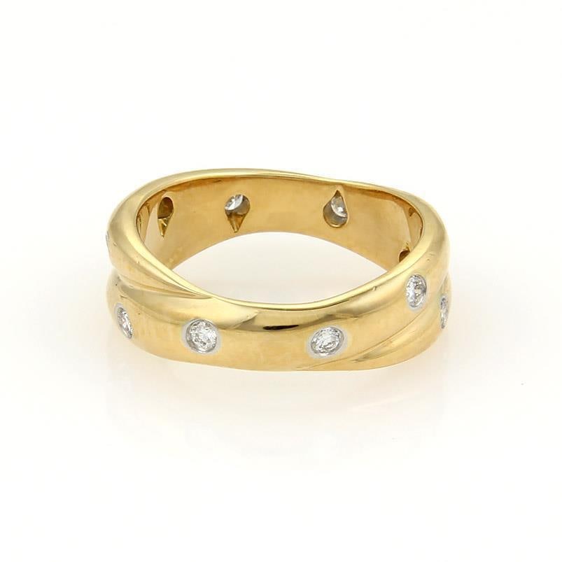 Tiffany & Co. Etoile Crossover Ring 18k Yellow Gold Platinum Diamonds: Tiffany & Co. Etoile Crossover Ring 18k Yellow Gold Platinum Diamonds Discover the elegance of the Tiffany & Co. Etoile Ring, a stunning band crafted from 18k yellow gold and platinum. This modern yet