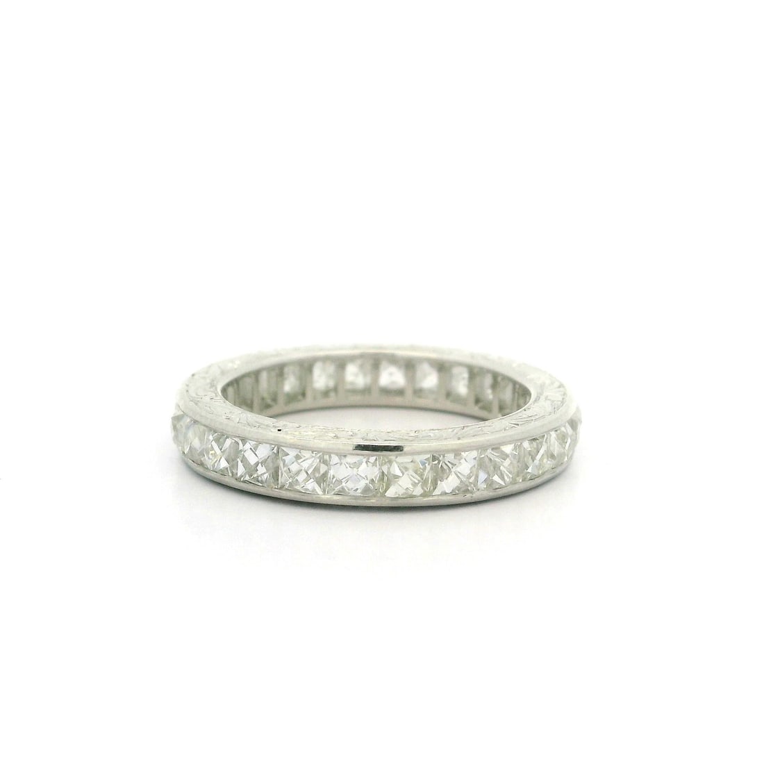 Vintage Platinum 3.45ctw Channel Set French Cut Diamond Eternity Band: Vintage Platinum 3.45ctw Channel Set French Cut Diamond Eternity Band This exquisite vintage eternity band features a stunning array of 26 natural genuine diamonds, each cut in the classic Old French 