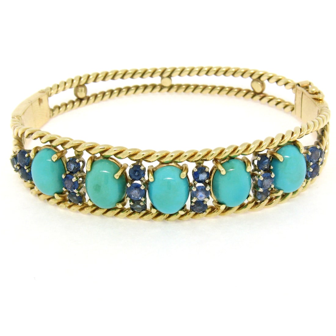 Vintage 13k-14K Yellow Gold Sapphire Turquoise Open Bangle Bracelet: Vintage 13k-14K Yellow Gold Sapphire Turquoise Open Bangle Bracelet This exquisite vintage bangle bracelet is crafted from solid yellow gold, featuring a stunning combination of natural sapphires and 