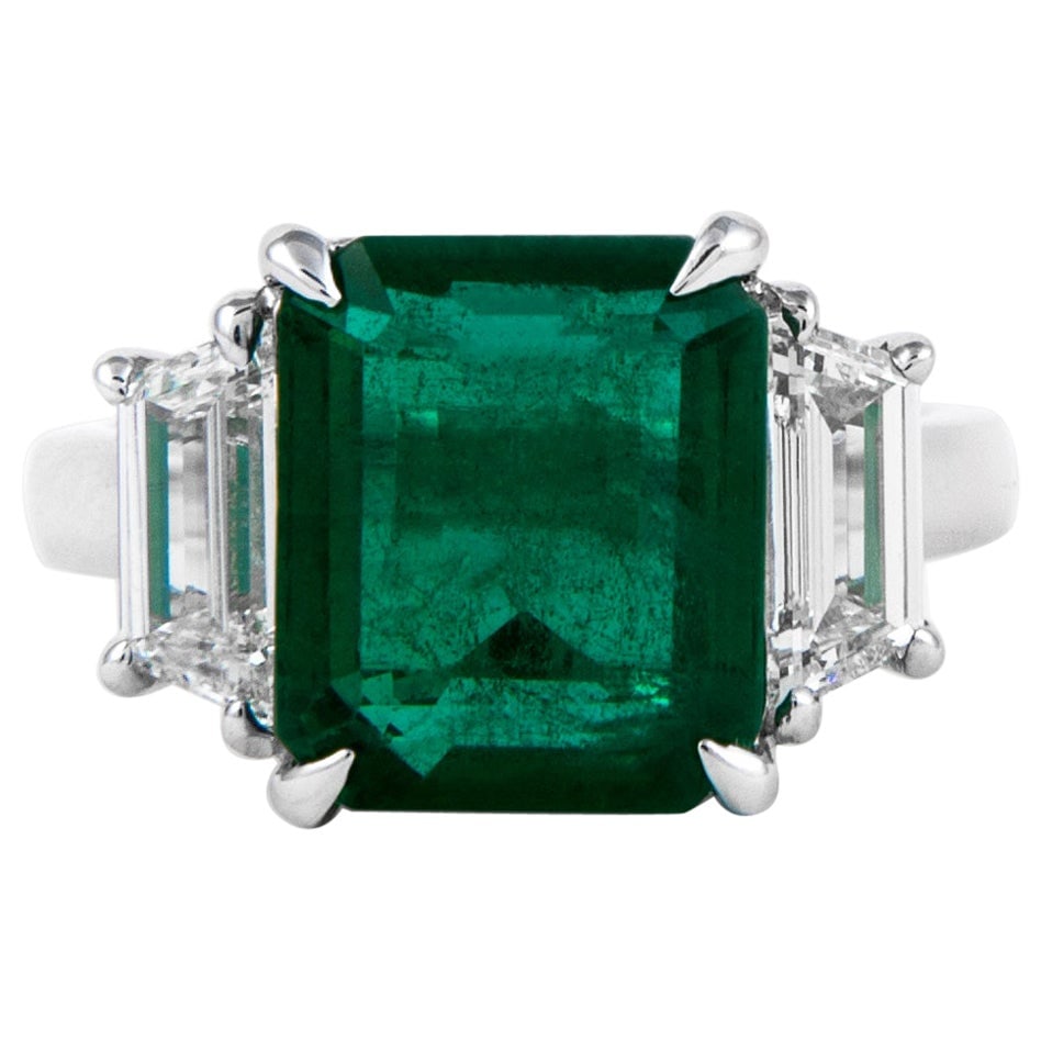 GIA 5.17ct Emerald Diamond 3-Stone Ring 18k White Gold: GIA 5.17ct Emerald Diamond 3-Stone Ring 18k White Gold This exquisite 3-stone ring features a stunning GIA-certified 5.17 ct emerald cut emerald, showcasing a vivid green color that is sure to captiva
