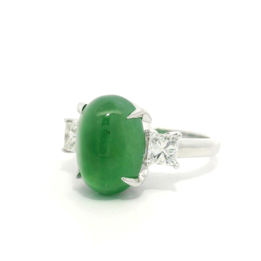 Platinum 5.73ct A Burma Jade Ring with Princess Diamonds GIA Certified: Platinum 5.73ct A Burma Jade Ring with Princess Diamonds GIA Certified Elevate your style with this exquisite cocktail ring featuring a stunning 5.73 carats of translucent A-grade apple green Burma ja