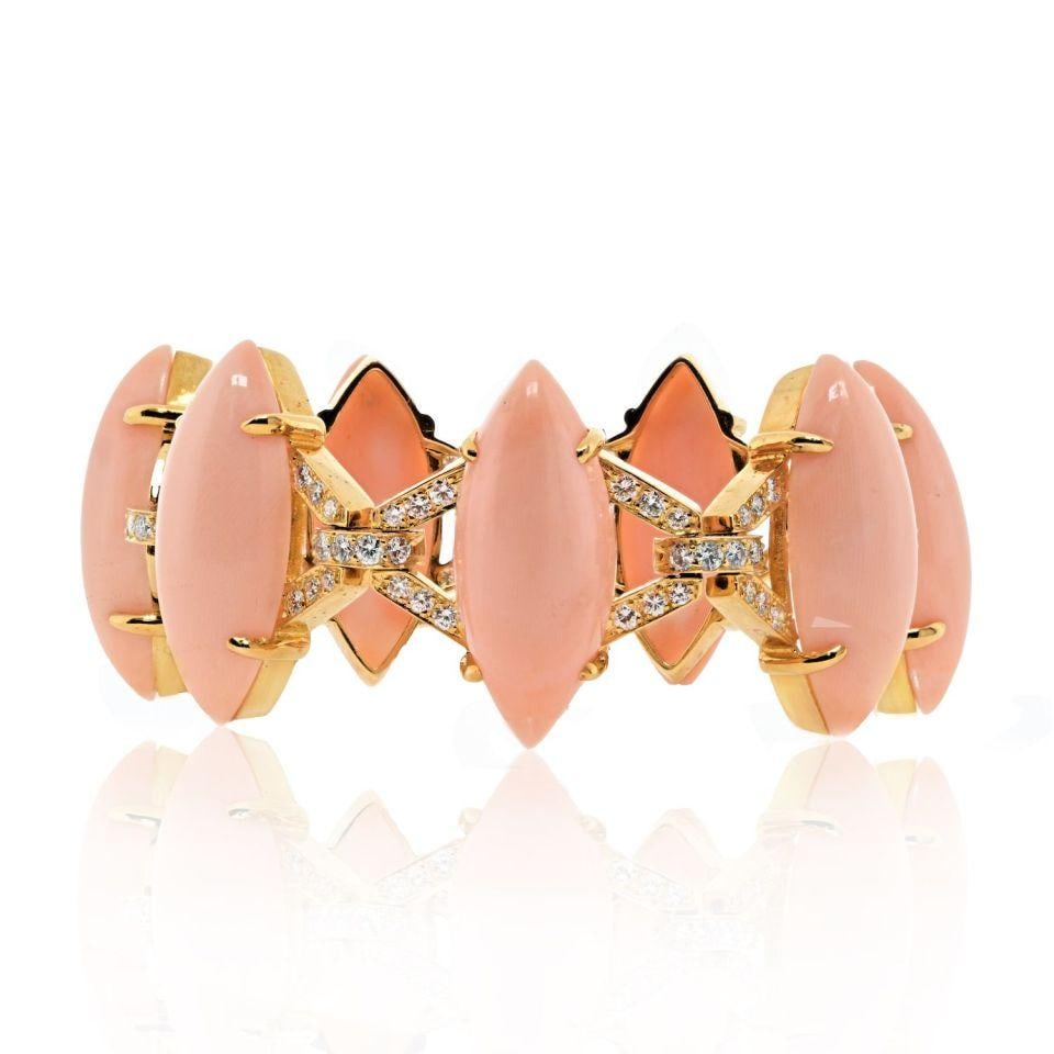 David Webb Platinum 18K Yellow Gold Coral Diamond Bracelet 5.00ct: David Webb Platinum 18K Yellow Gold Coral Diamond Bracelet 5.00ct This exquisite bracelet is a stunning combination of platinum and 18K yellow gold, weighing 55.7 grams. It features seven marquise-sha