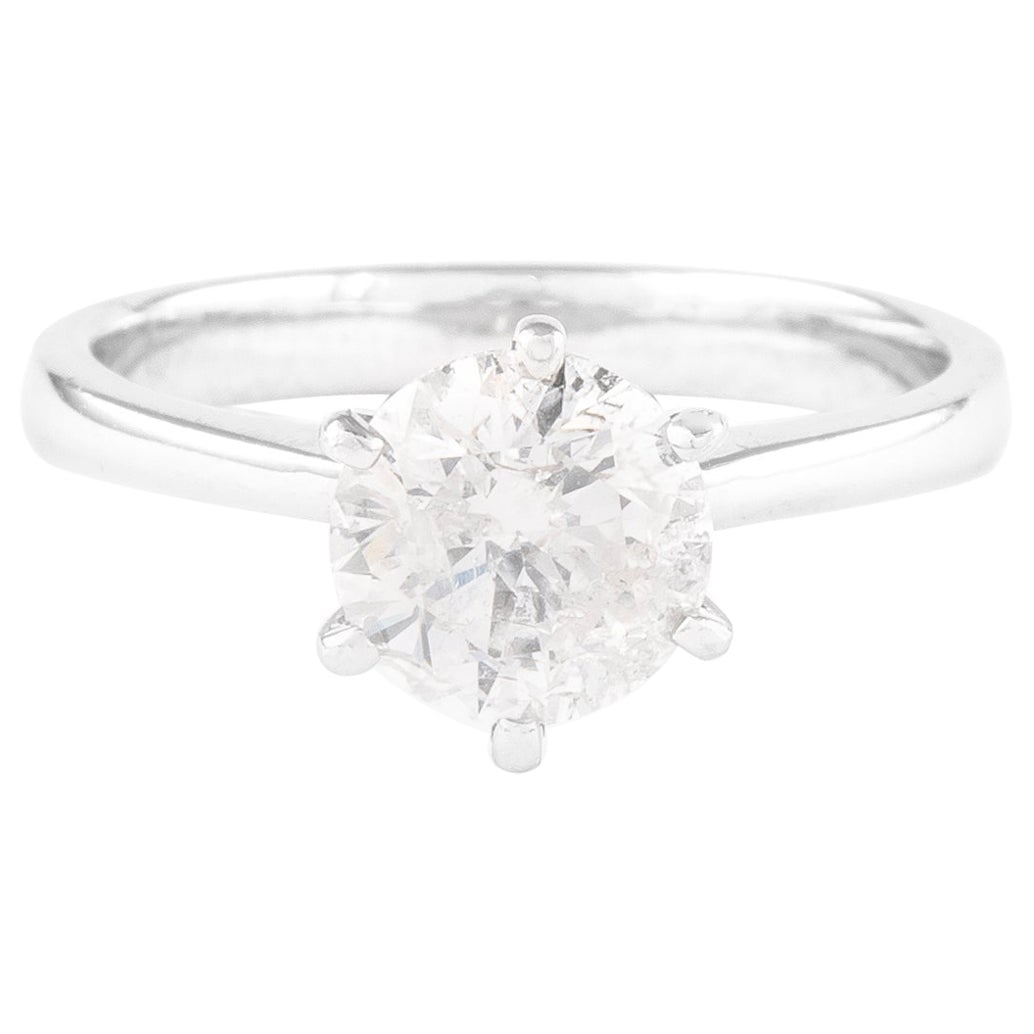 1.55 Carat Round Brilliant Diamond Ring in 18K White Gold Tiffany Style: 1.55 Carat Round Brilliant Diamond Ring in 18K White Gold Tiffany Style This exquisite engagement ring features a stunning 1.55 carat round brilliant diamond, set in a classic Tiffany-style solitaire 